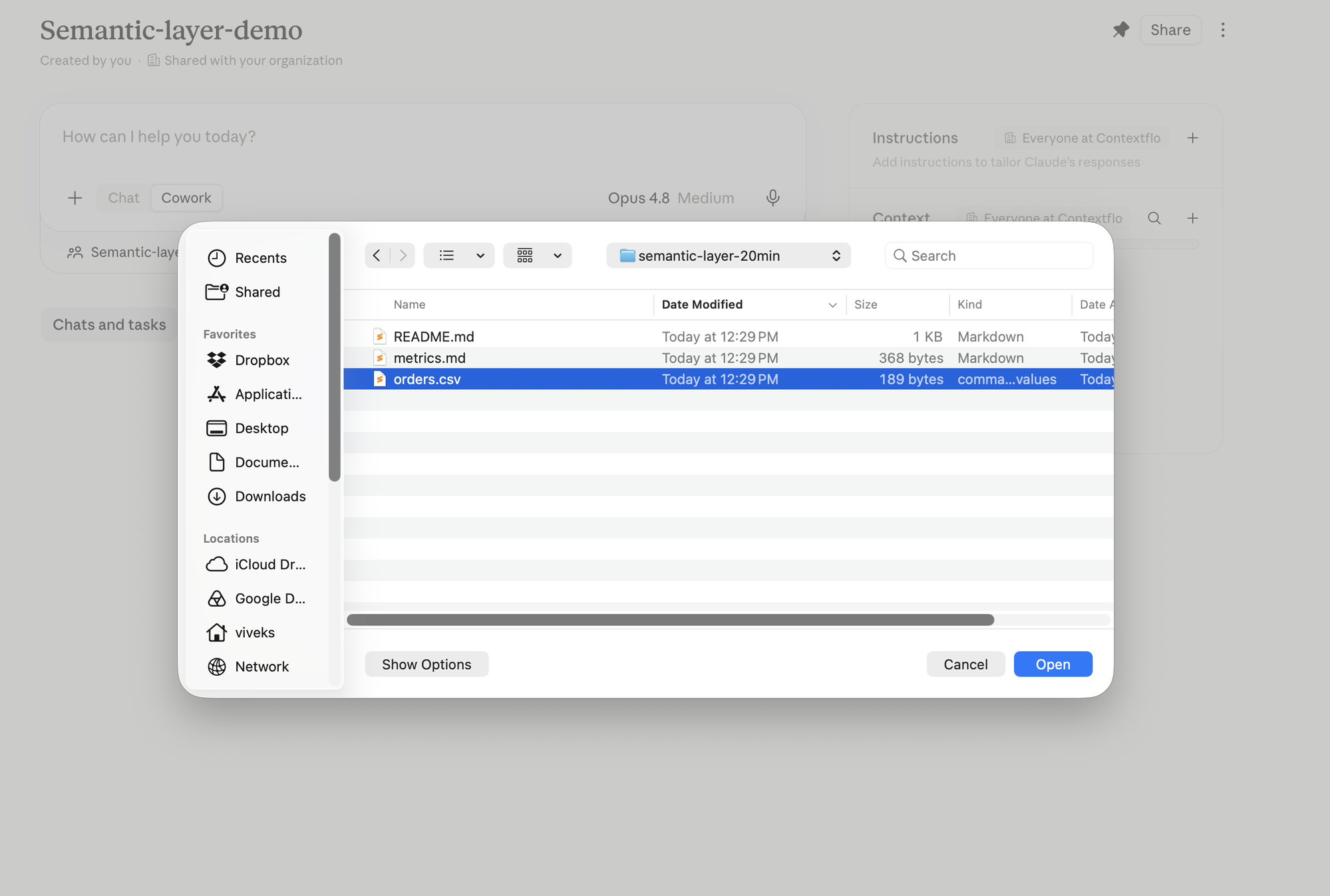 The file picker uploading orders.csv into the Claude project, alongside metrics.md and README.md